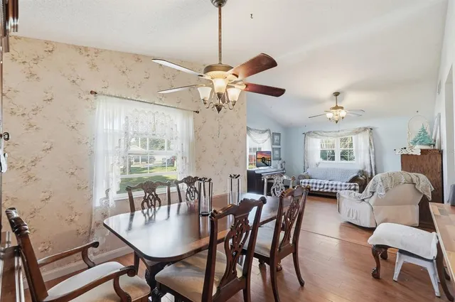 a kitchen with stainless steel appliances a stove a sink and cabinets