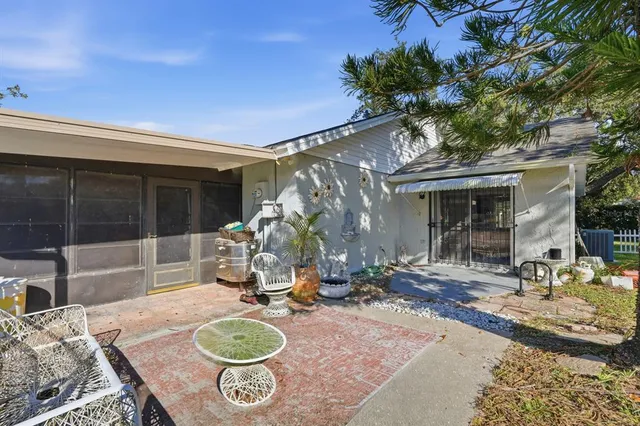 a front view of a house with a garden and yard