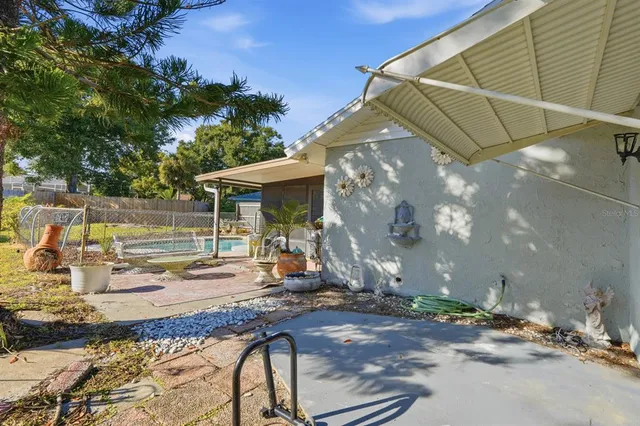 a view of a chairs and table in the garden