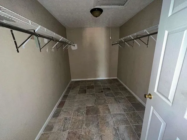 a view of a room with racks on the wall