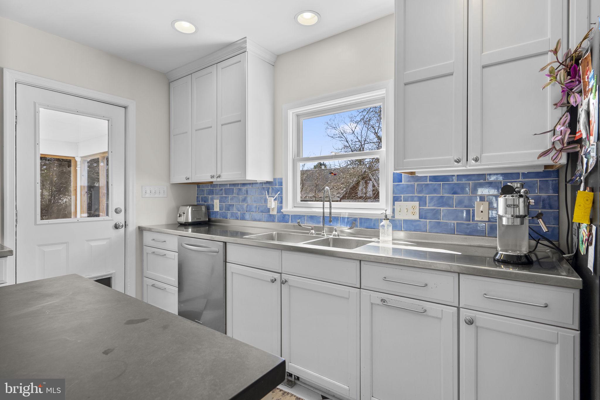 212 Dearborn Avenue Silver Spring, MD 20901 - Photo 15 of 42 Kitchen with door to screen porch and backyard