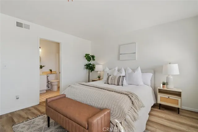 a bedroom with a bed and a table