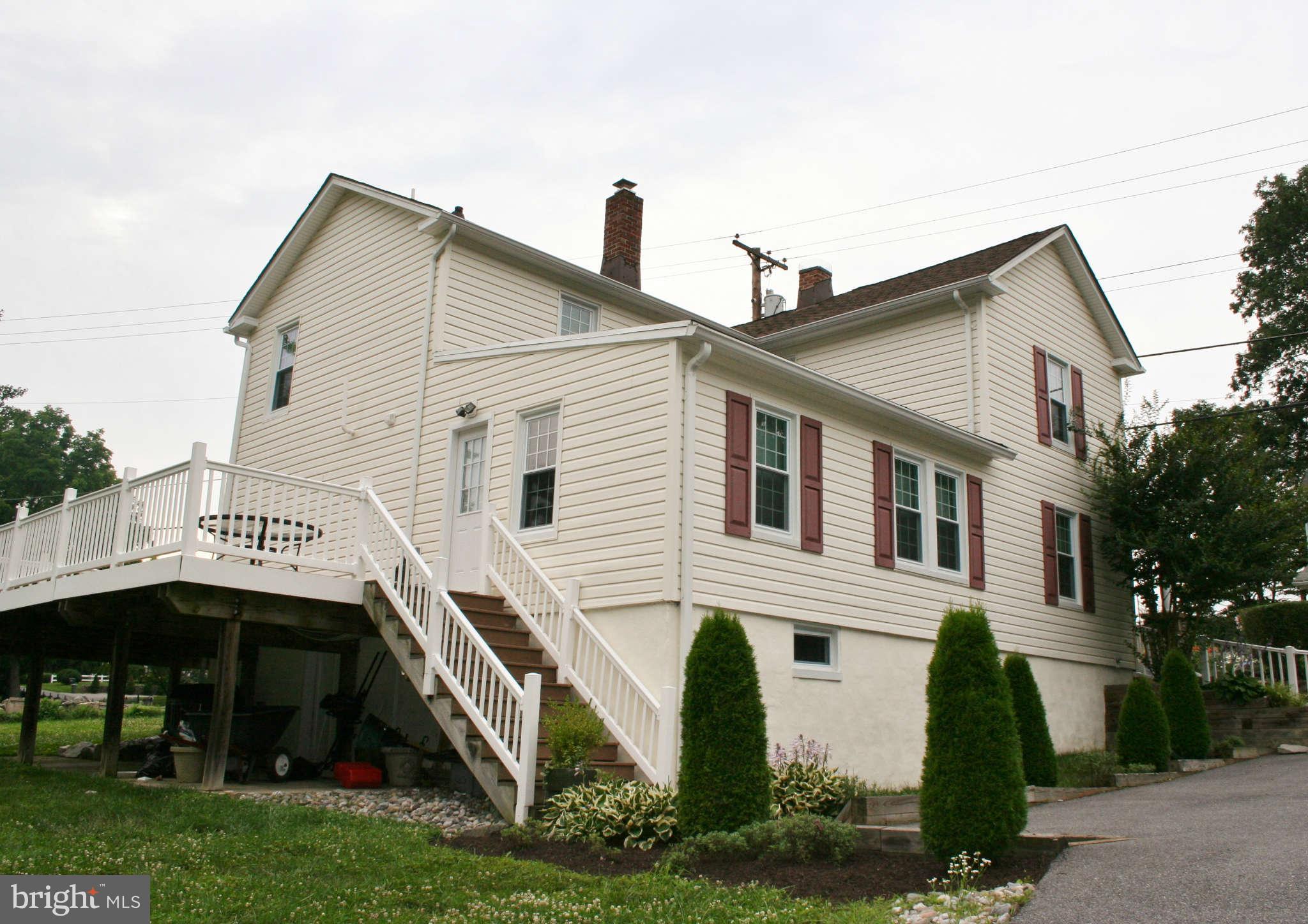 10529 Old Court Road Woodstock, MD 21163 - Photo 3 of 26 a view of a house with a yard and plants