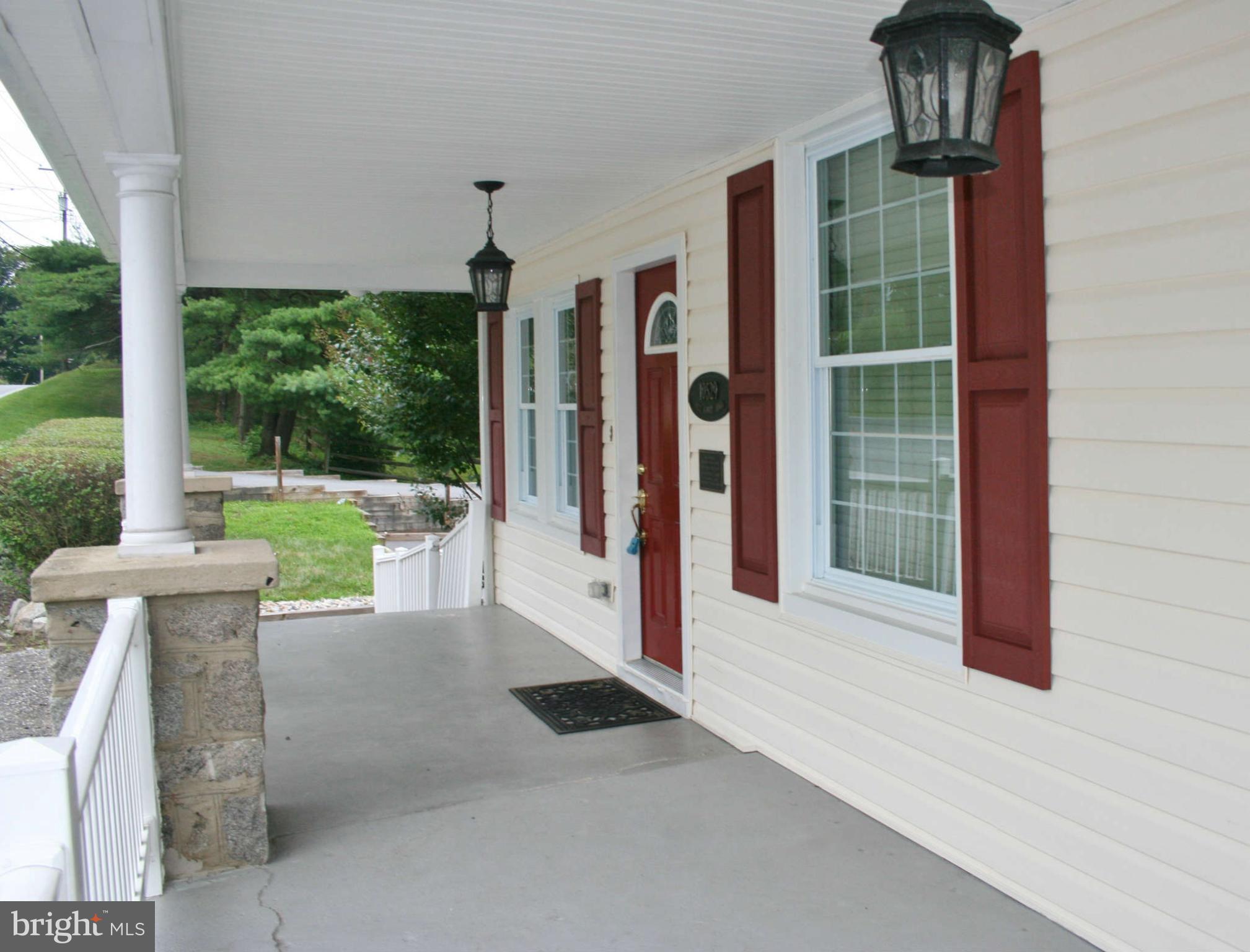 10529 Old Court Road Woodstock, MD 21163 - Photo 7 of 26 a view of a building with a potted plant and a porch