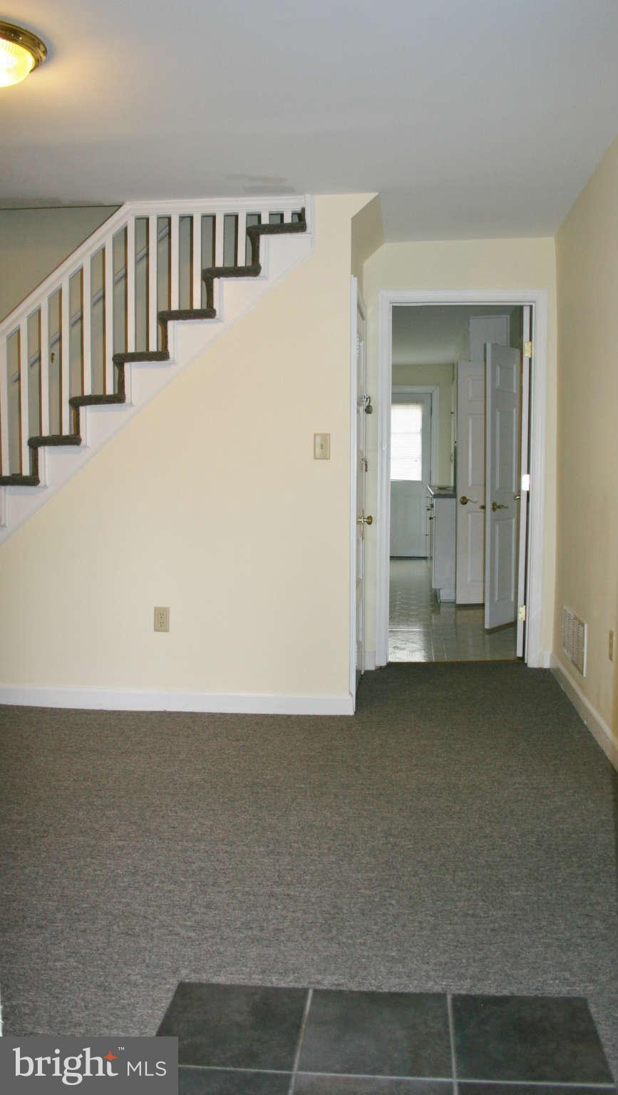 10529 Old Court Road Woodstock, MD 21163 - Photo 8 of 26 a view of a big room with closet and windows
