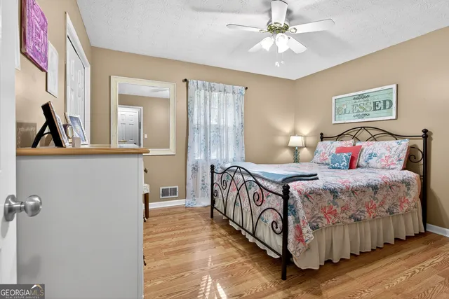 a bedroom with a bed and furniture