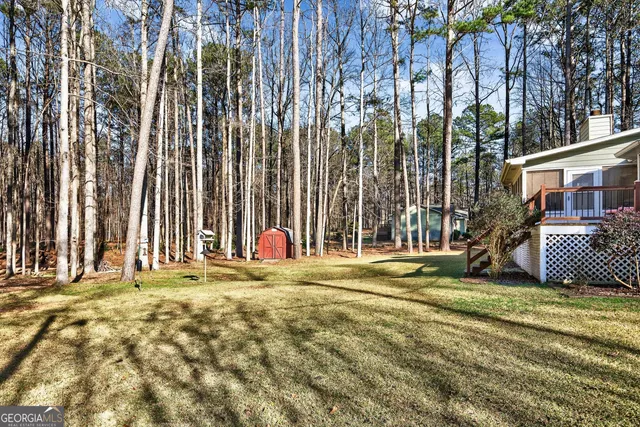 a view of a chair and tables in the balcony