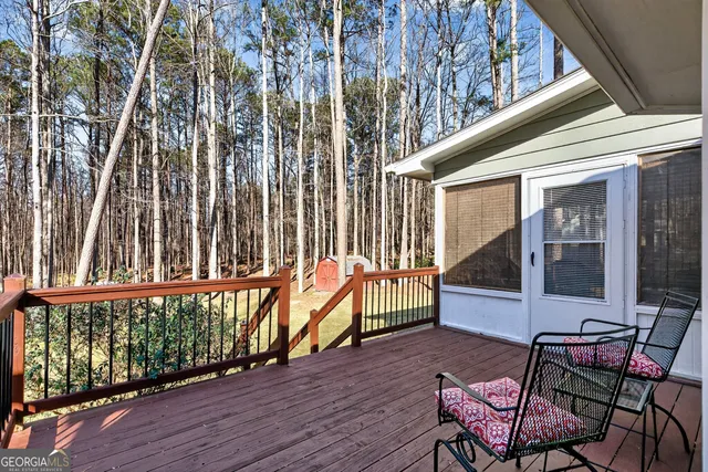 a swimming pool with outdoor seating and yard
