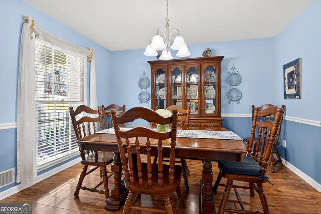 a kitchen with stainless steel appliances granite countertop a stove and a refrigerator