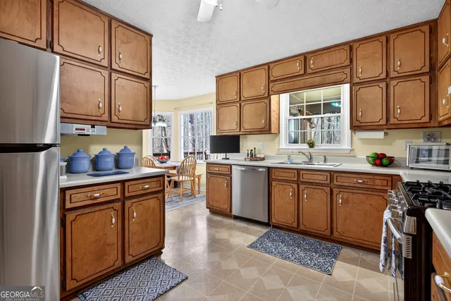 a view of a dining room with furniture and window