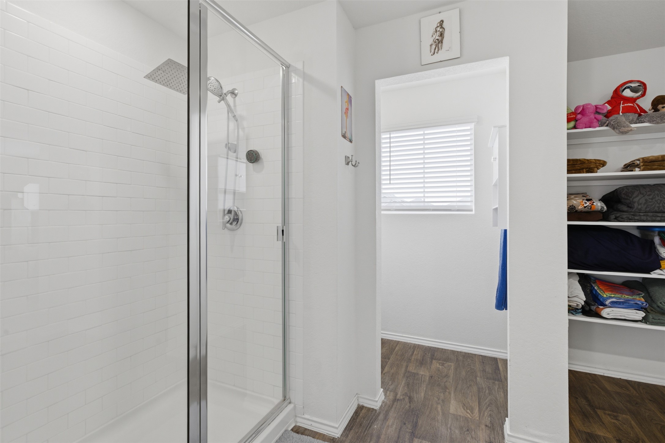 19017 Romano Drive Elgin, TX 78621 - Photo 26 of 33 Walk-in shower with clear glass enclosure and subway tile surround