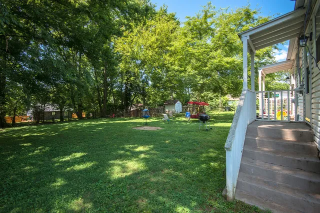 a view of a park with large trees