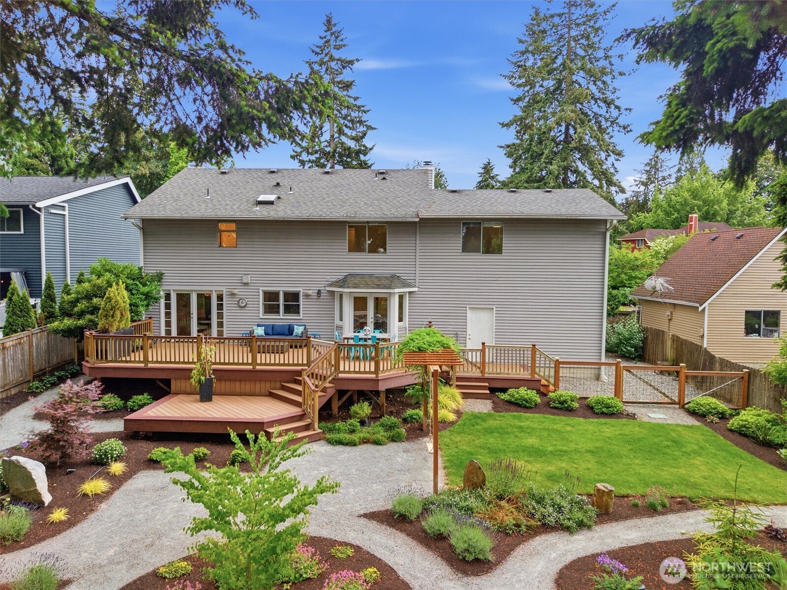 2101 233rd Street Southeast Bothell, WA 98021 - Photo 23 of 40 a front view of a house with garden and sitting area