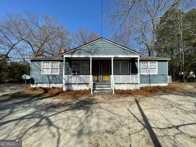 a front view of a house with a outdoor space