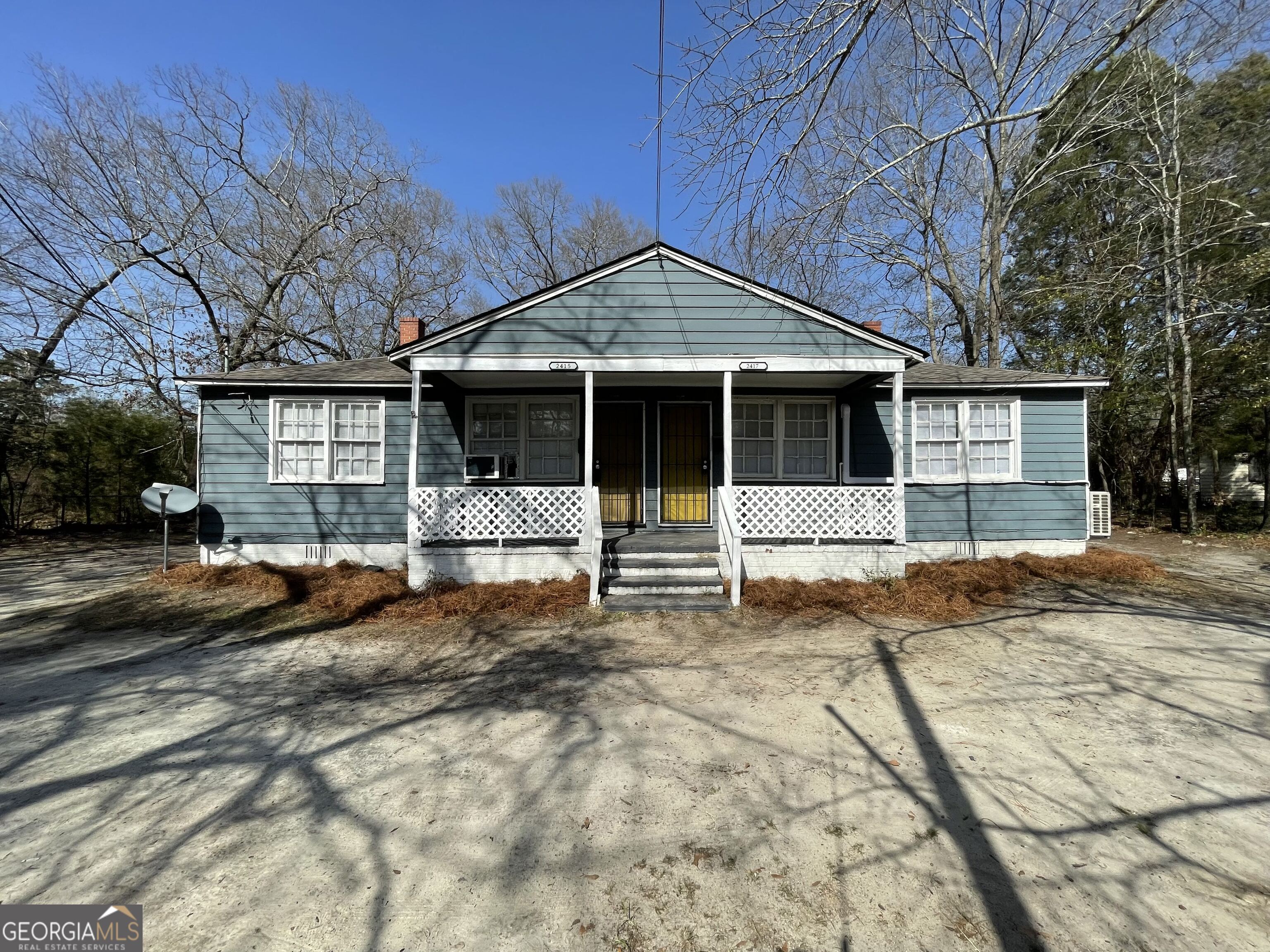 a front view of a house with a outdoor space