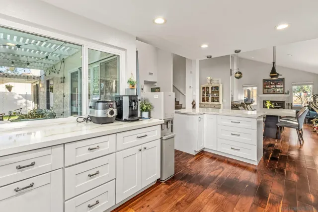 a spacious bathroom with a double vanity sink and a mirror