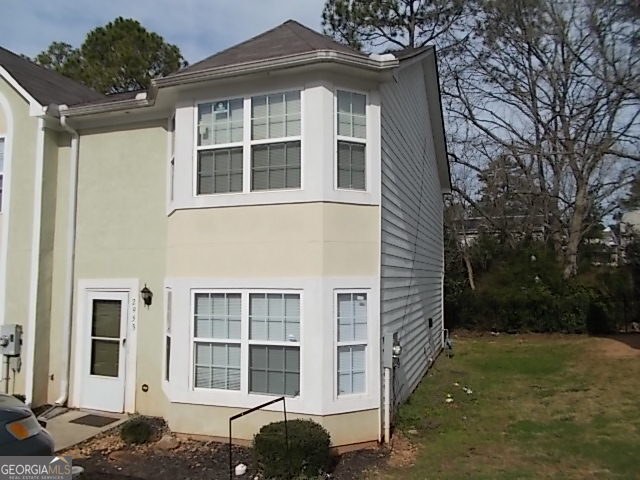 a front view of a house with a yard