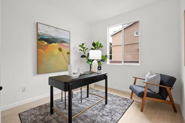 a view of a workspace with furniture