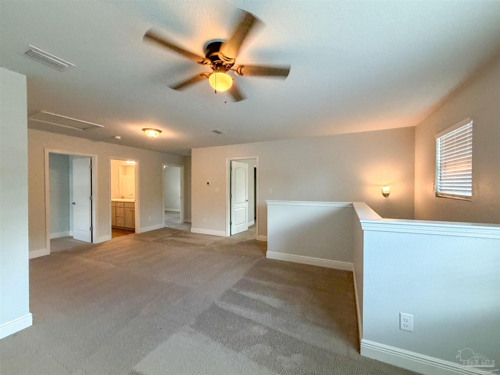 3613 Conley Drive Cantonment, FL 32533 - Photo 20 of 32 a view of a livingroom with a chandelier fan and a window