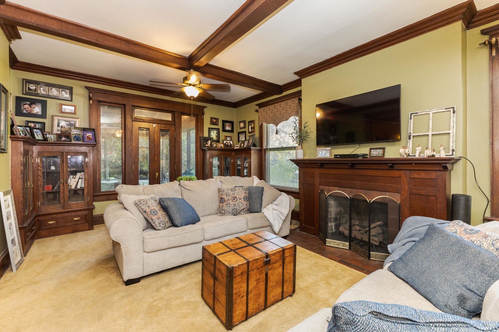 1111 East Grove Street Bloomington, IL 61701 - Photo 18 of 56 a living room with furniture a flat screen tv and a fireplace