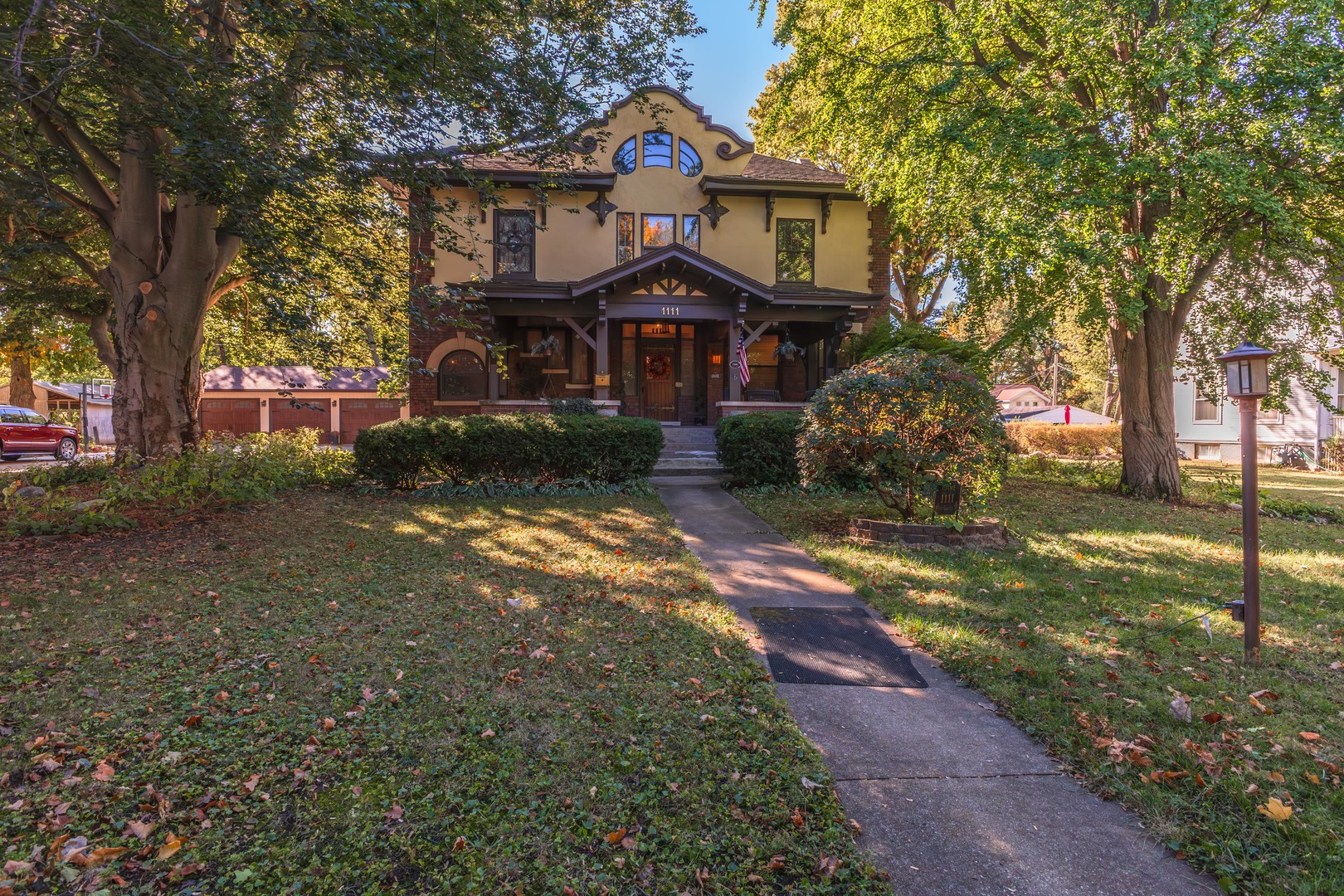 1111 East Grove Street Bloomington, IL 61701 - Photo 2 of 56 a front view of a house with a yard