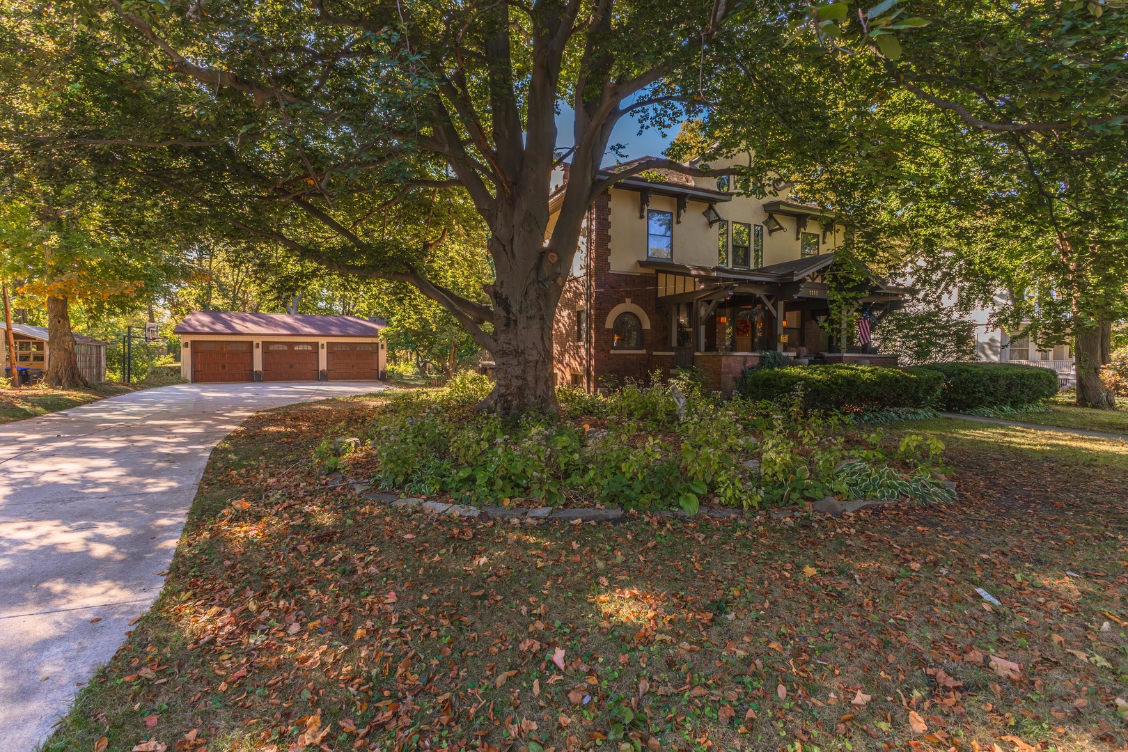 1111 East Grove Street Bloomington, IL 61701 - Photo 3 of 56 a front view of a house with garden