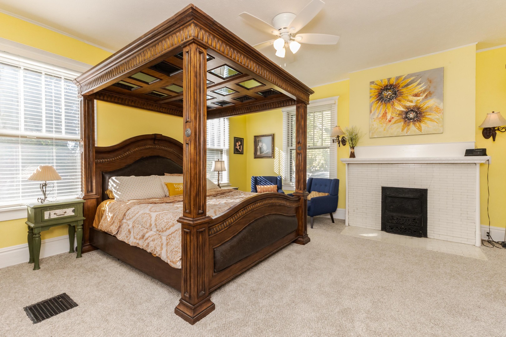 1111 East Grove Street Bloomington, IL 61701 - Photo 36 of 56 a bedroom with a bed and a fireplace