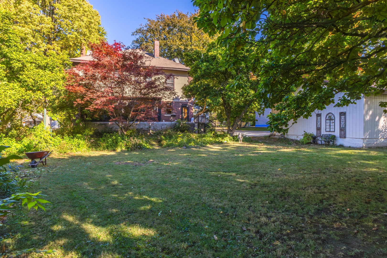 1111 East Grove Street Bloomington, IL 61701 - Photo 44 of 56 a view of a house with a big yard and large trees