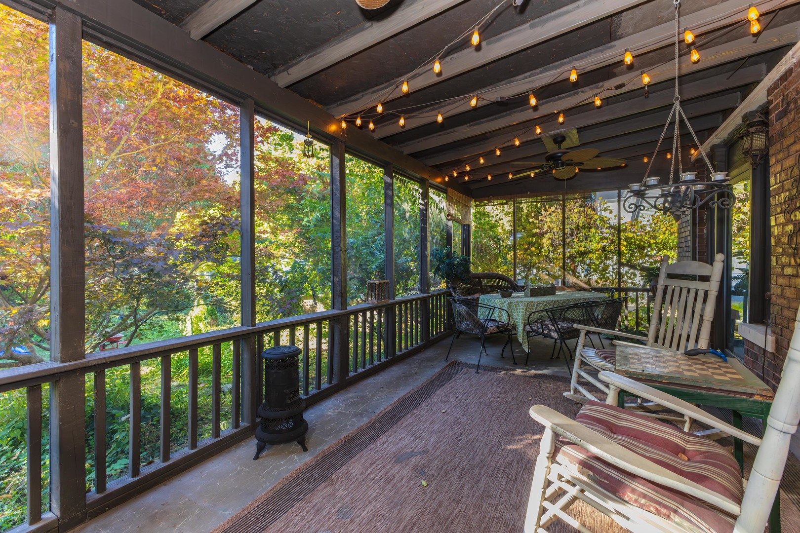 1111 East Grove Street Bloomington, IL 61701 - Photo 45 of 56 a view of a chairs and table in patio with wooden floor