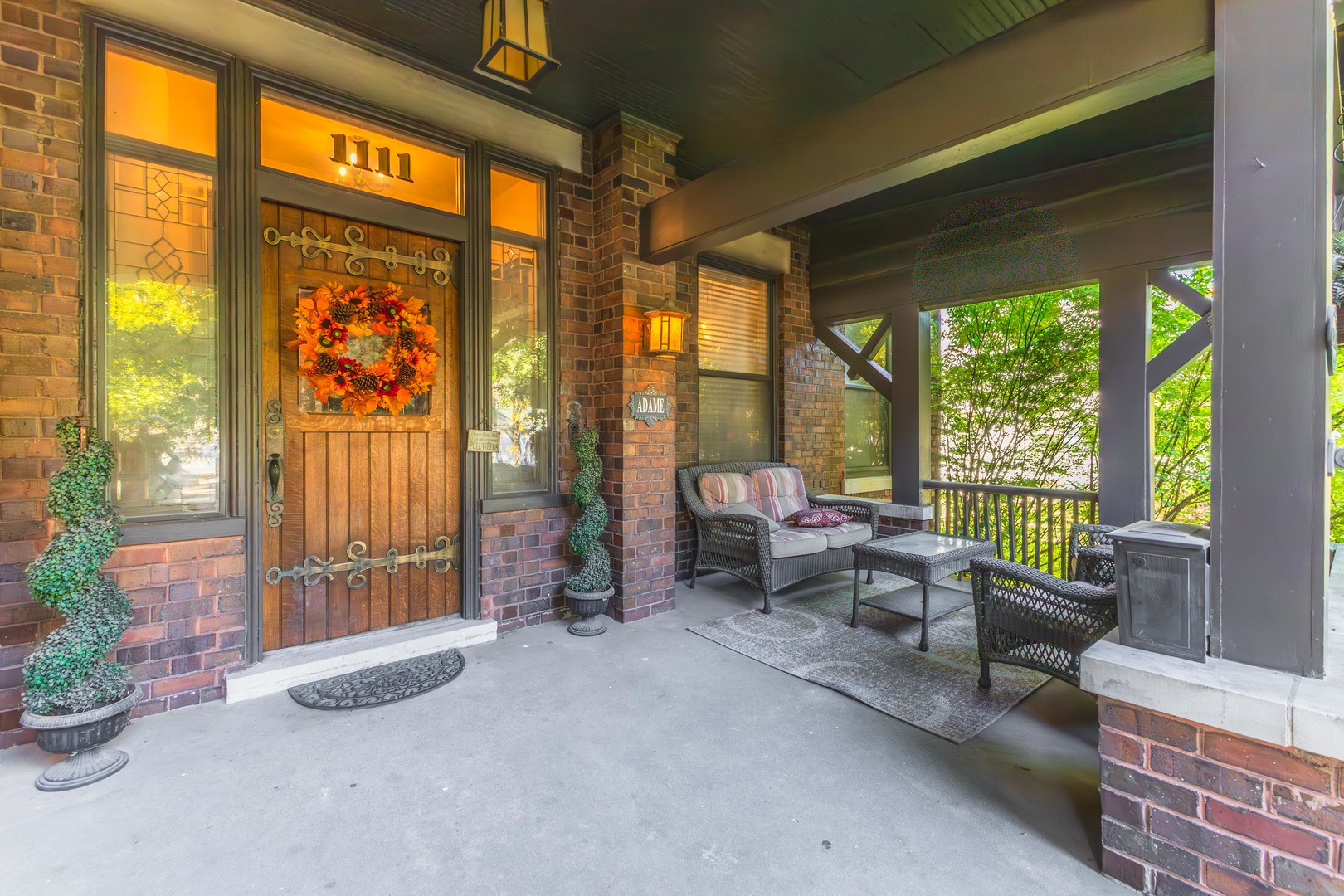 1111 East Grove Street Bloomington, IL 61701 - Photo 6 of 56 a living room filled with furniture and a potted plant