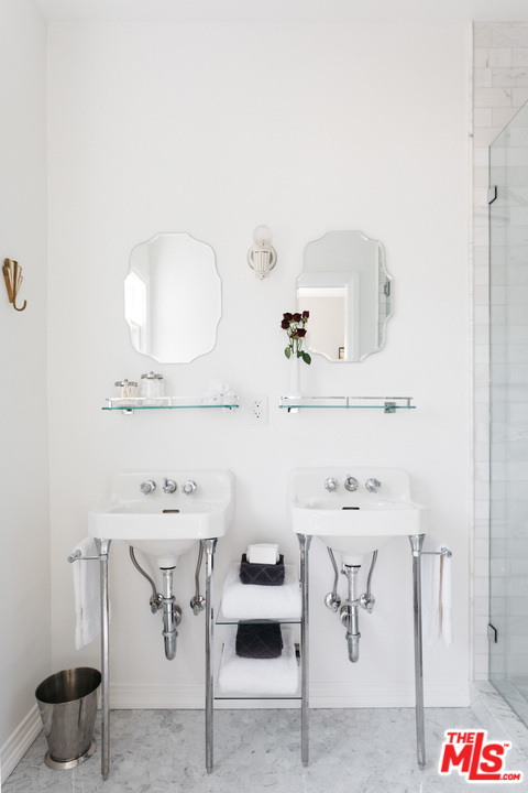 6151 Barrows Drive Los Angeles, CA 90048 - Photo 13 of 25 a bathroom with a sink and a mirror