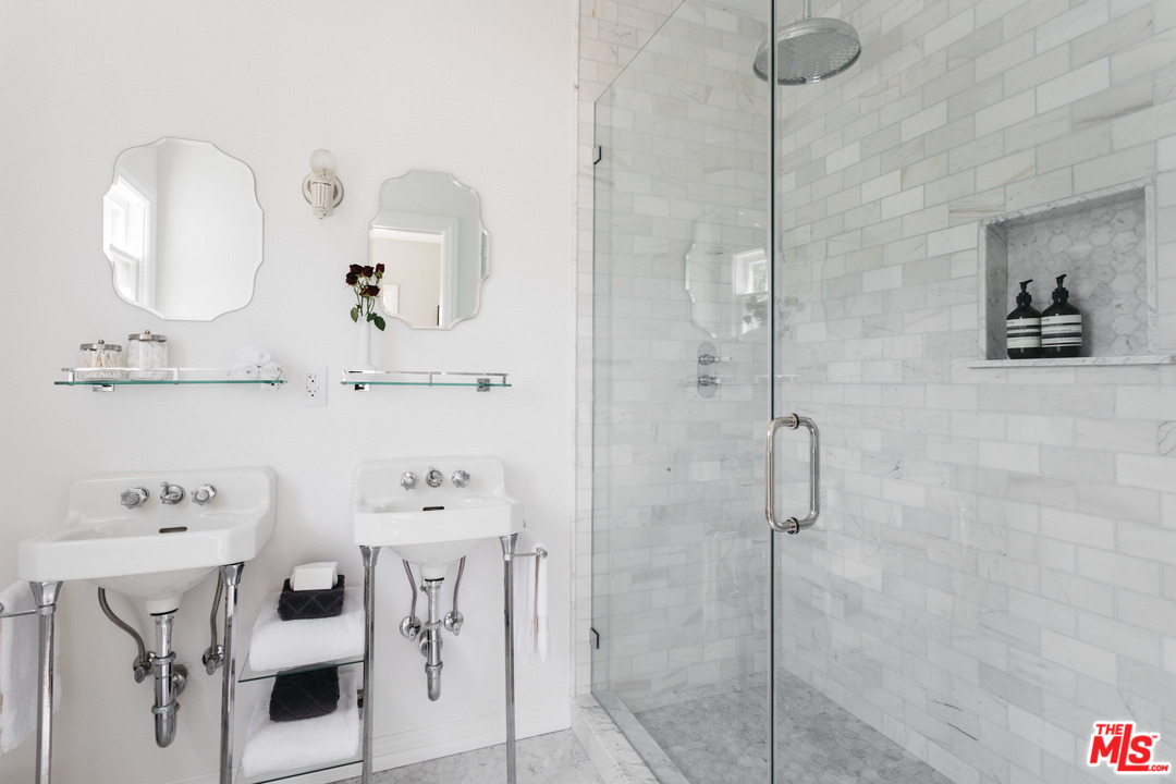 6151 Barrows Drive Los Angeles, CA 90048 - Photo 15 of 25 a bathroom with a sink mirror and vanity