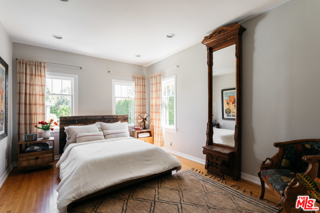 6151 Barrows Drive Los Angeles, CA 90048 - Photo 16 of 25 a bedroom with a bed and a window