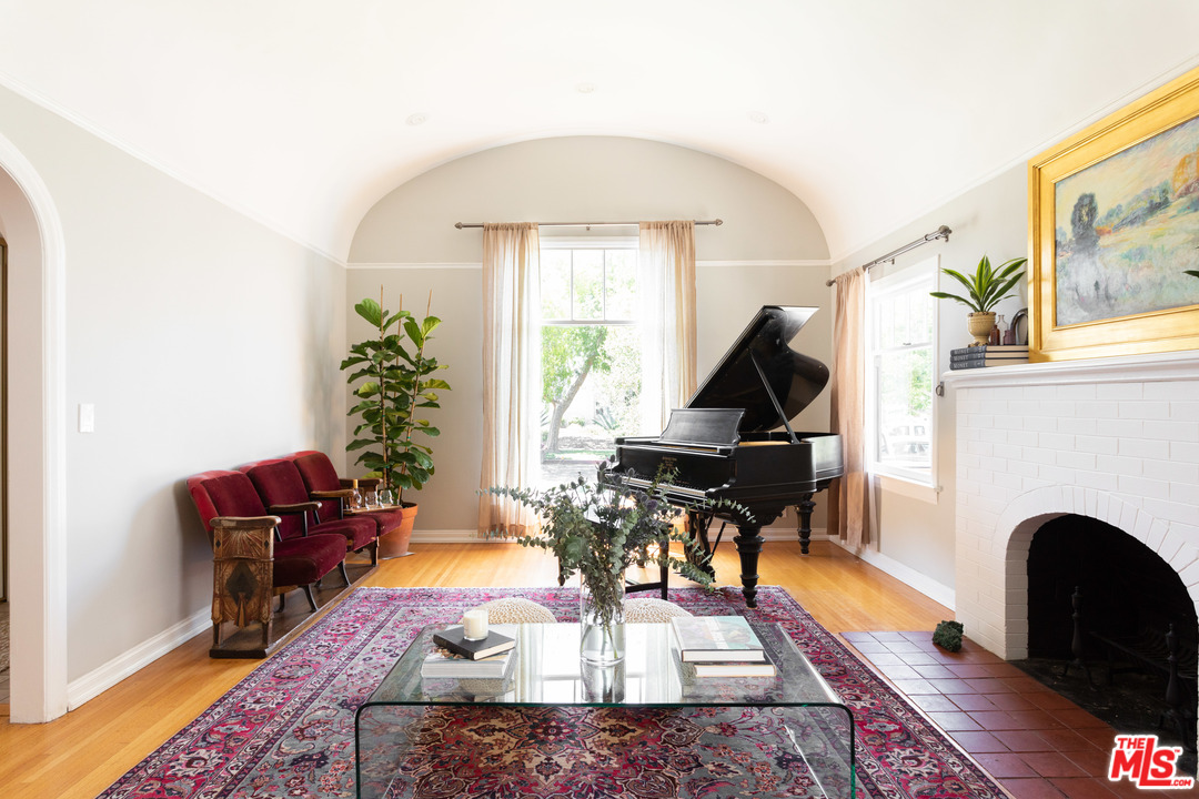 6151 Barrows Drive Los Angeles, CA 90048 - Photo 3 of 25 a living room with furniture and a fireplace