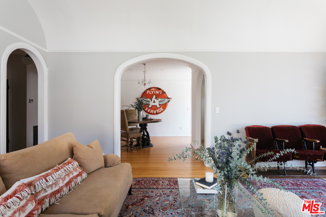 6151 Barrows Drive Los Angeles, CA 90048 - Photo 5 of 25 a living room with furniture and a rug