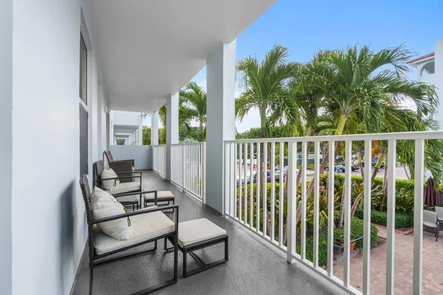 a view of a balcony with chairs