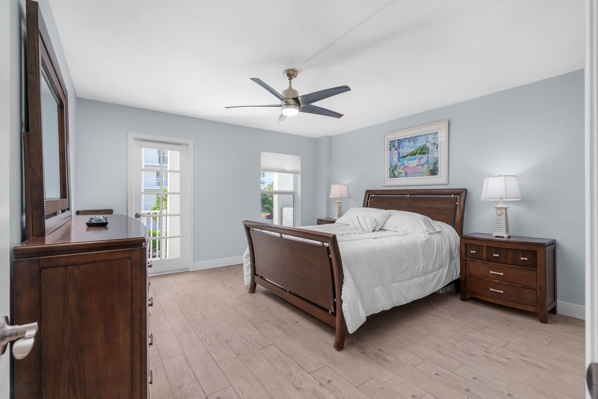 950 Ponce De Leon Road, Unit 207 Boca Raton, FL 33432 - Photo 15 of 36 a spacious bedroom with a bed and a dresser