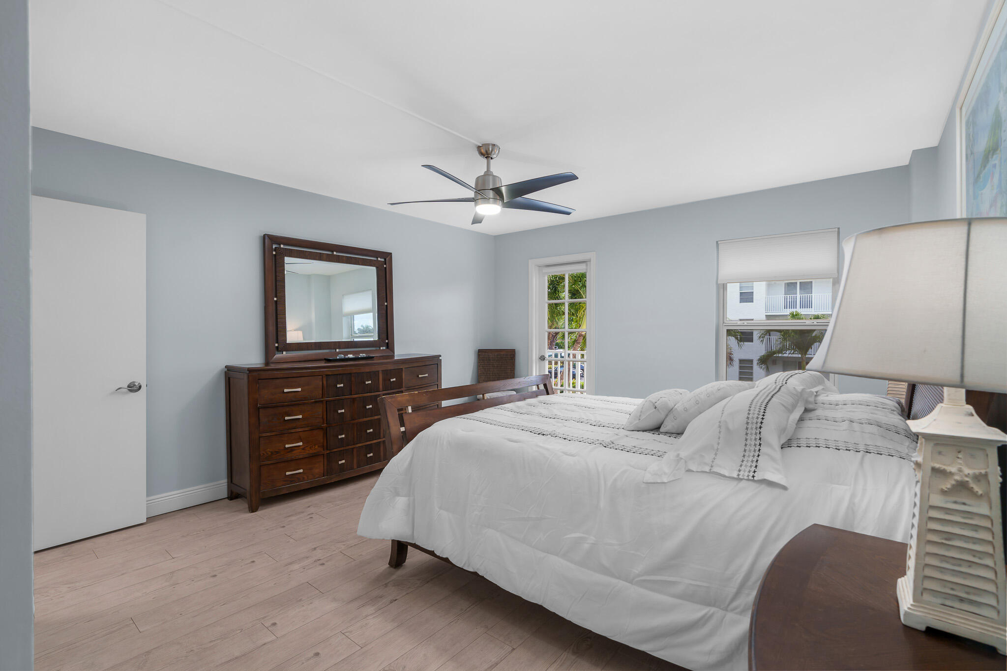 950 Ponce De Leon Road, Unit 207 Boca Raton, FL 33432 - Photo 16 of 36 a bedroom with a bed and a dresser