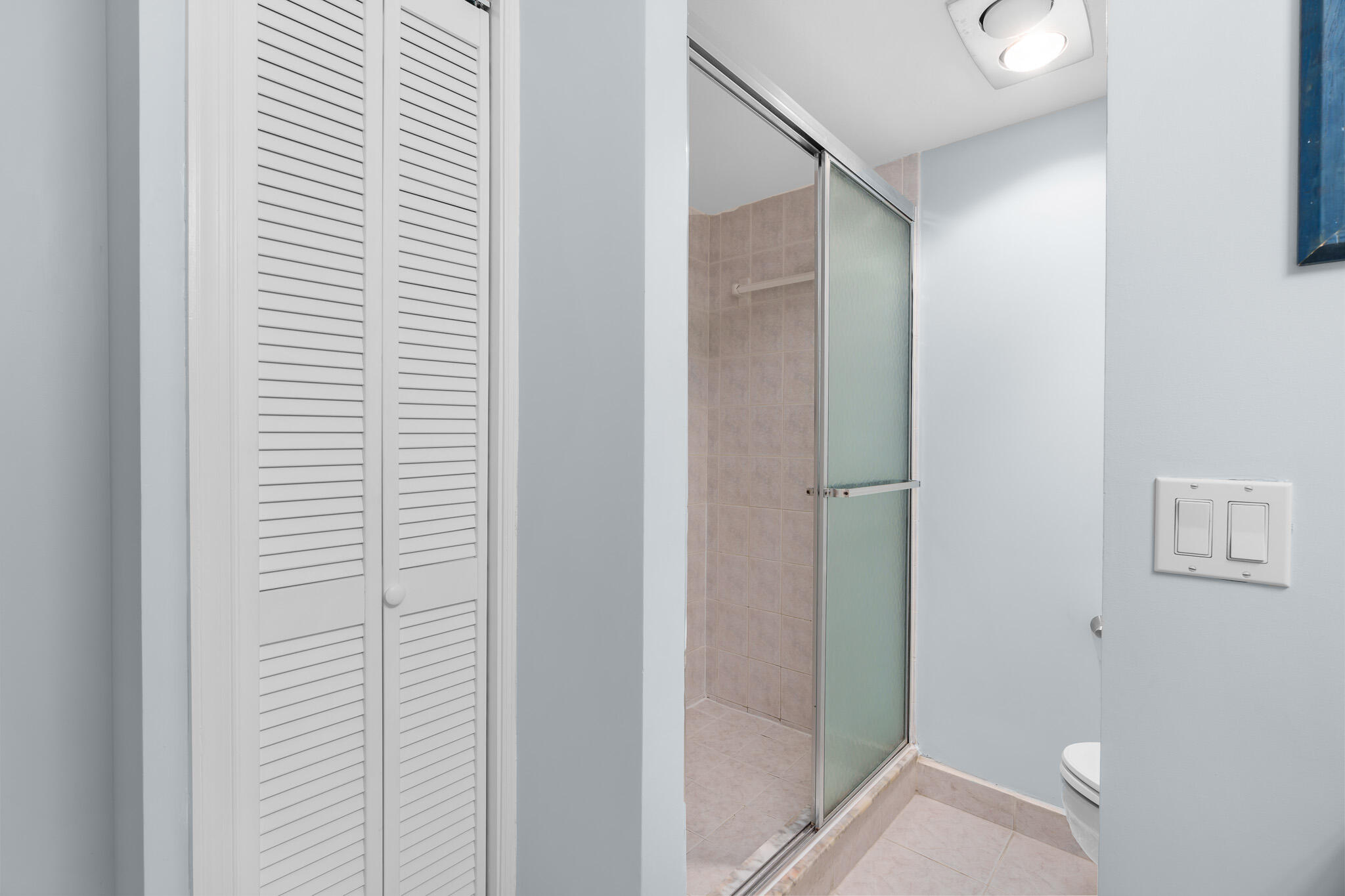 950 Ponce De Leon Road, Unit 207 Boca Raton, FL 33432 - Photo 21 of 36 a view of a bathroom from a hallway