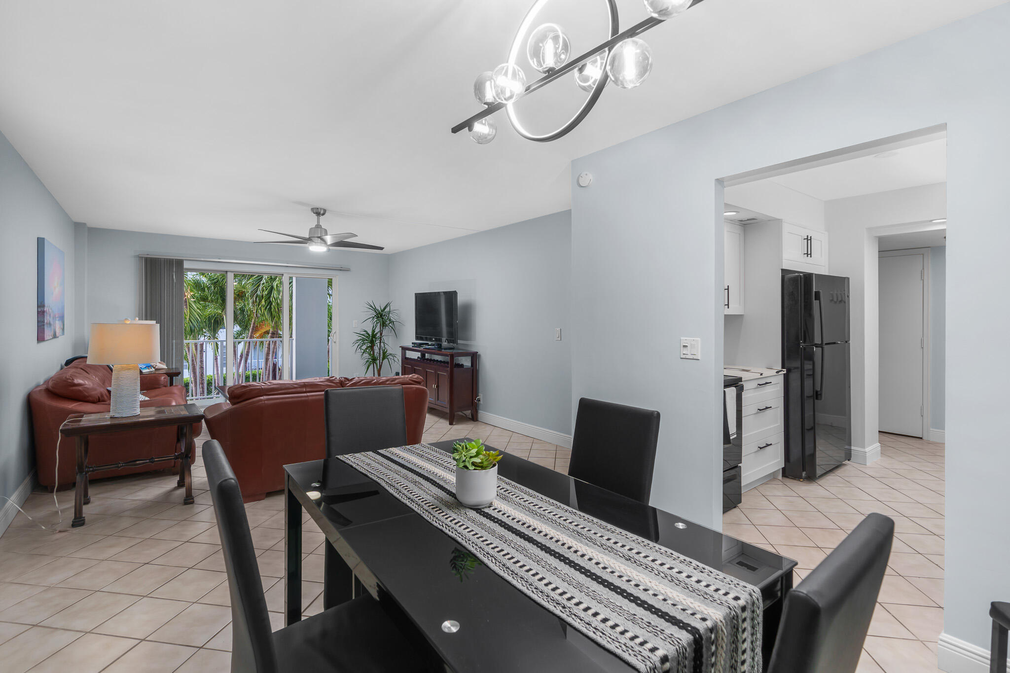 950 Ponce De Leon Road, Unit 207 Boca Raton, FL 33432 - Photo 7 of 36 a workspace with furniture and a chandelier