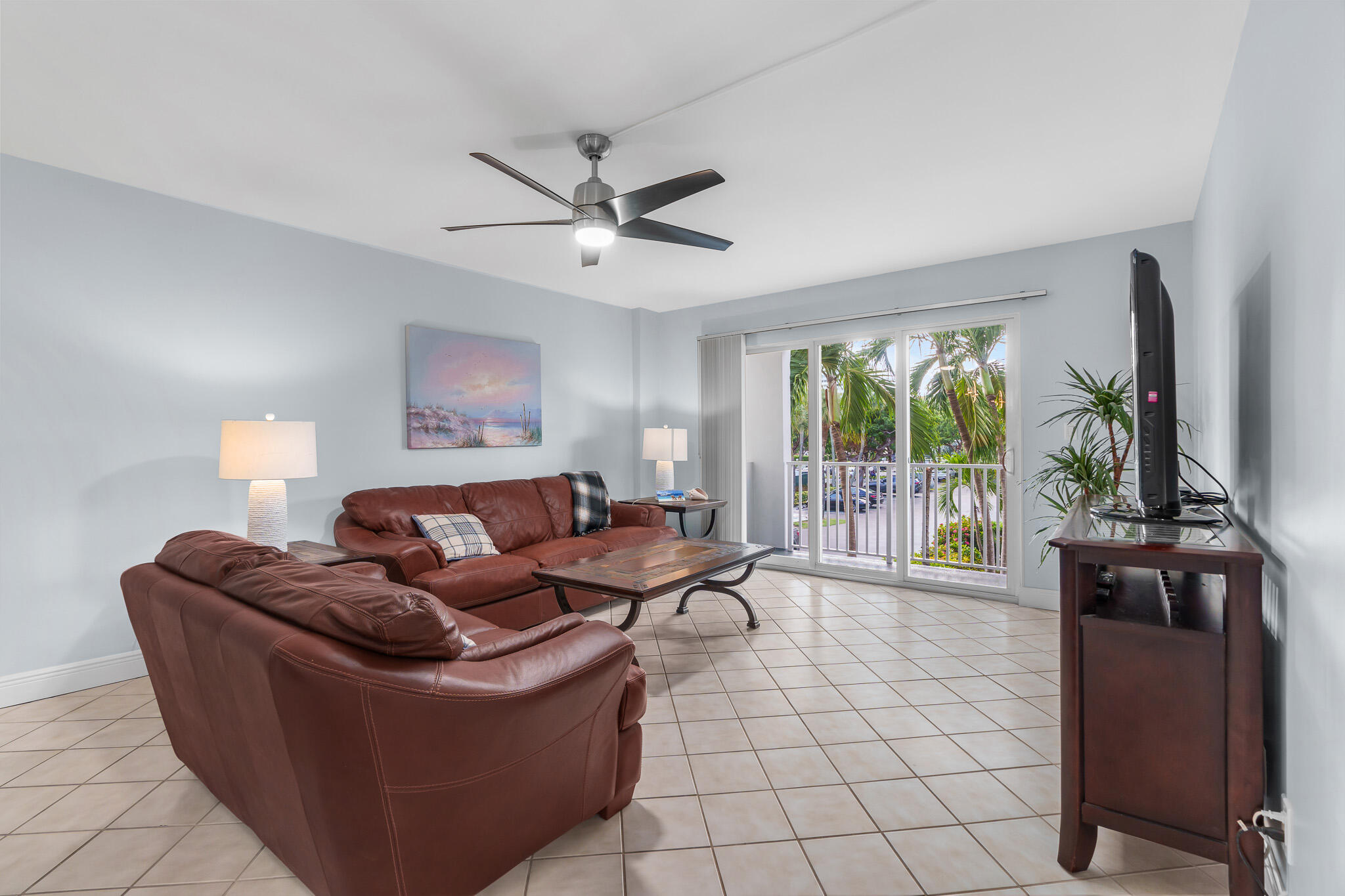 950 Ponce De Leon Road, Unit 207 Boca Raton, FL 33432 - Photo 8 of 36 a living room with furniture and a flat screen tv