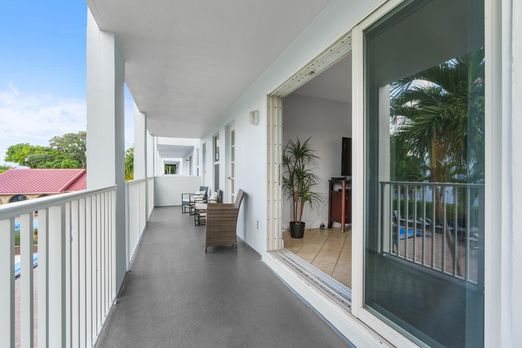 950 Ponce De Leon Road, Unit 207 Boca Raton, FL 33432 - Photo 10 of 36 a view of a porch and garden