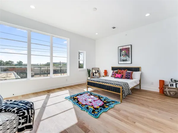 a bedroom with furniture and a window