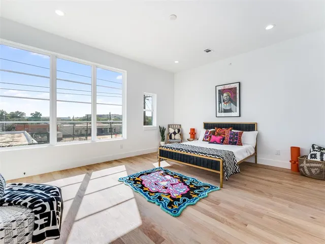 a bedroom with furniture and a window