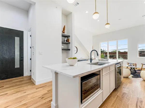 a kitchen with a stove and a sink