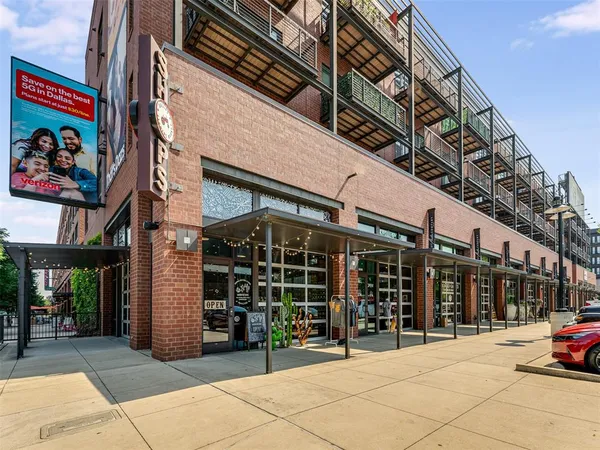 a view of a street with a building in the background