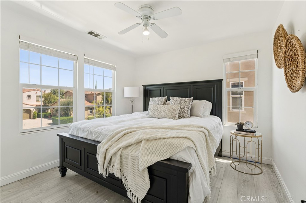 4155 Windspring Street Corona, CA 92883 - Photo 29 of 38 a bed sitting in a spacious bedroom next to a window