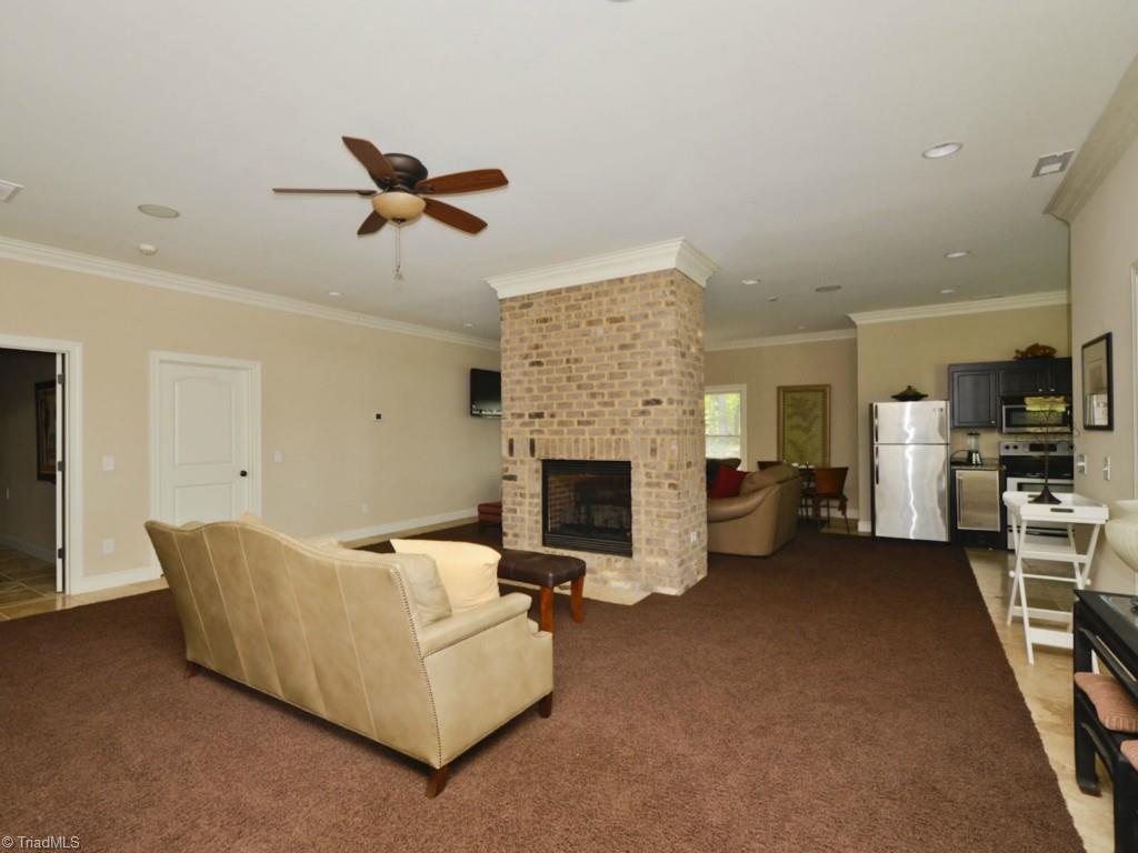 1156 Scout Road Lexington, NC 27292 - Photo 25 of 30 Separate Living Quarters in the Finished Basement includes, Den, sitting Area, Kitchenette, Theatre room, Wine Cellar, Separate Bed and Full Bath!