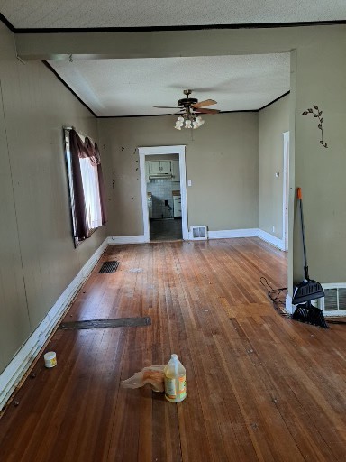 29 West 33rd Place Steger, IL 60475 - Photo 2 of 6 a view of a livingroom with wooden floor and a ceiling fan