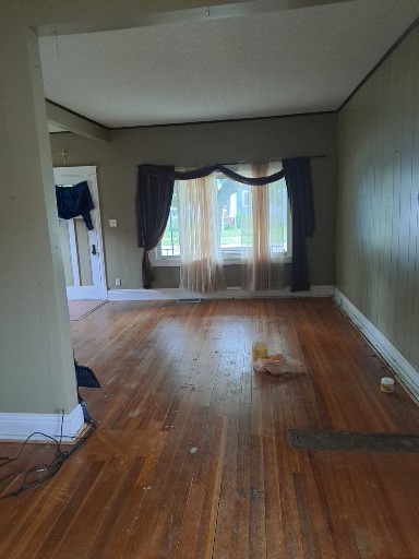 29 West 33rd Place Steger, IL 60475 - Photo 4 of 6 wooden floor in an empty room with a window